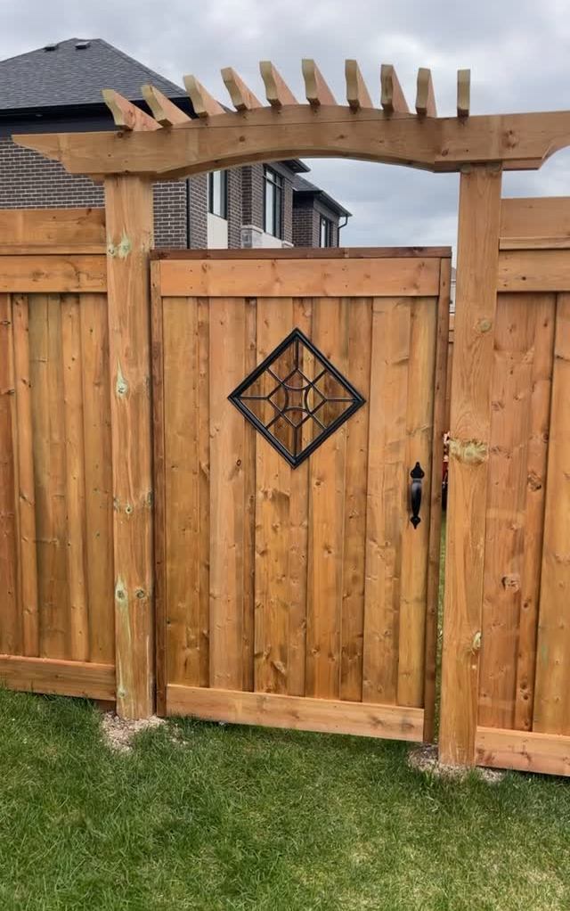 Custom cedar gate with a diamond insert under a cedar arbour